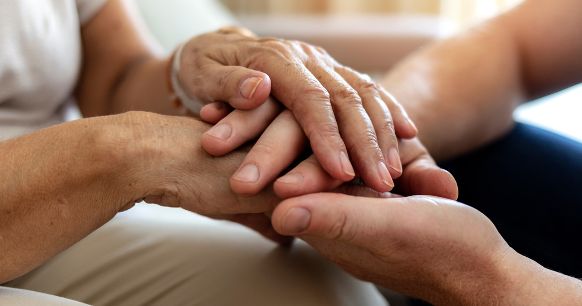 Caregiver-patient_hands_ByYourSide_web image