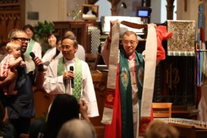 Bishop (right) Chang with a handmade stole